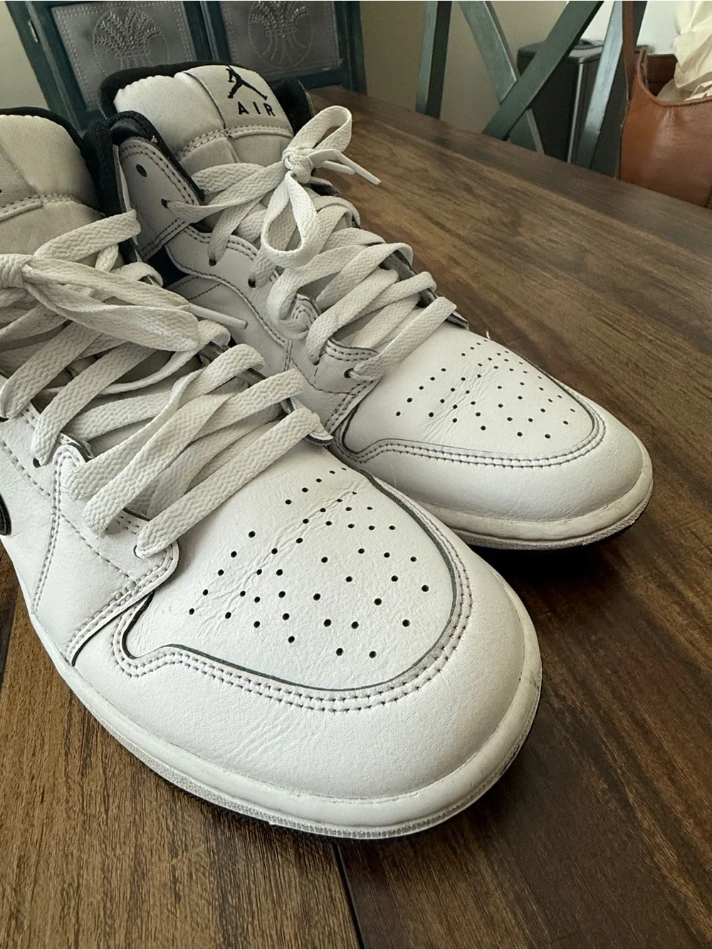 Nike Air Jordan 1 White and Black Mid-Top Sneakers